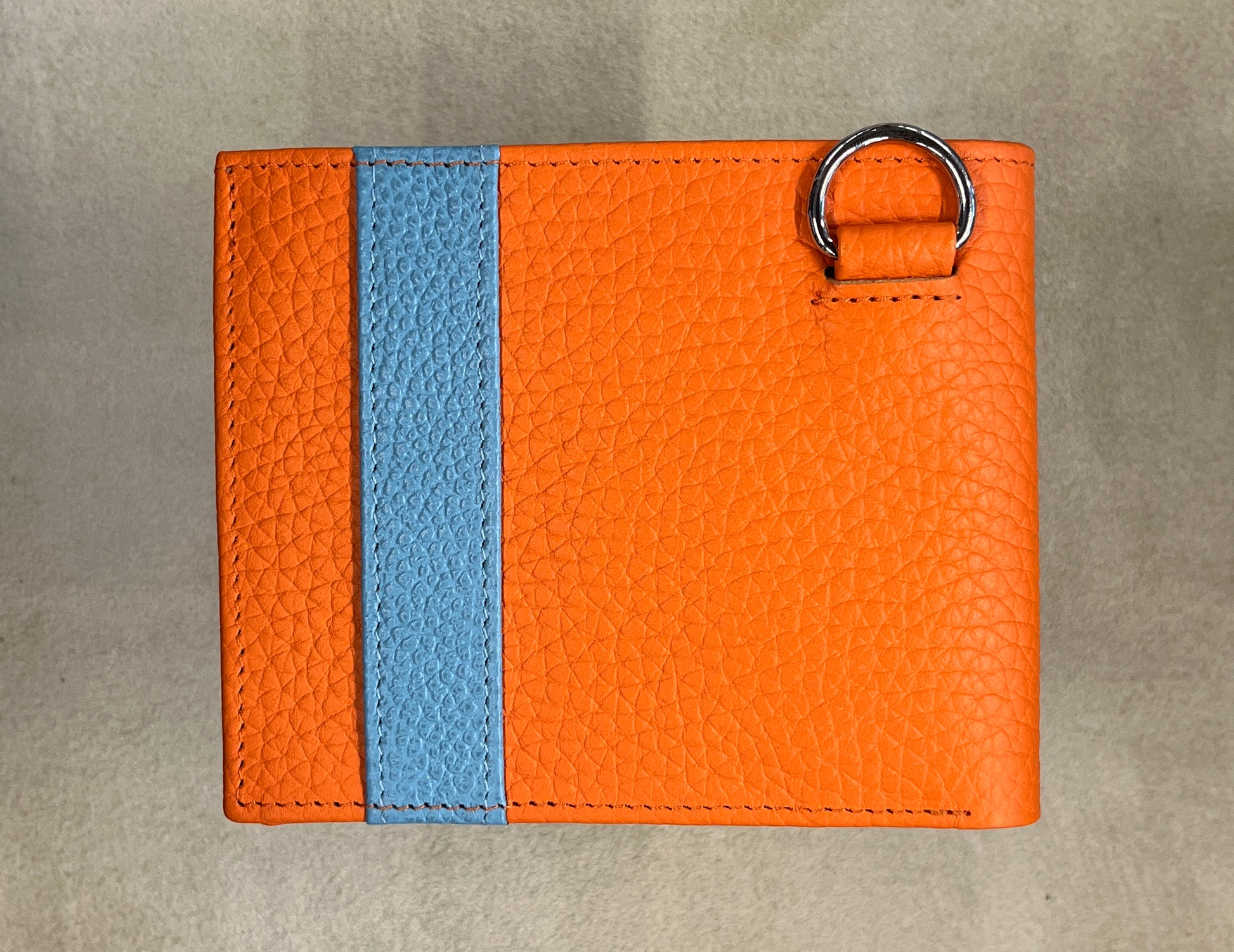 Handgemachte Geldbörse in orange und hellblau, hergestellt von R.Horns Wien.